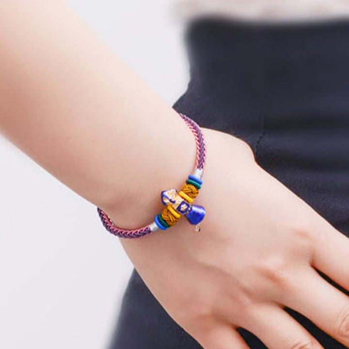 Bracelet tibétain fait main en corde Dorje Vajra à huit fils