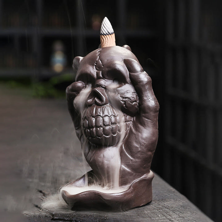Brûleur d'encens spirituel en argile violette avec tête de mort et main fantôme en Buddha Stones