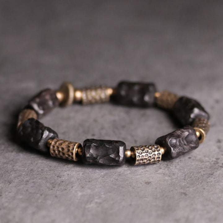 Bracelet tibétain en bois d'ébène et cuivre avec Buddha Stones pour la paix et le calme