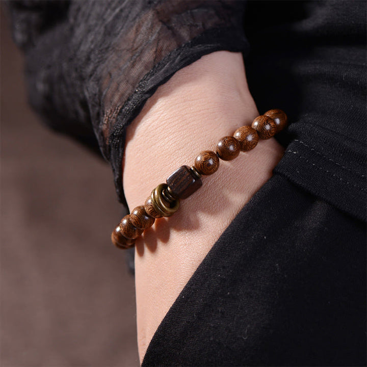 Bracelet de spiritualité en bois de Phoebe Zhennan Buddha Stones