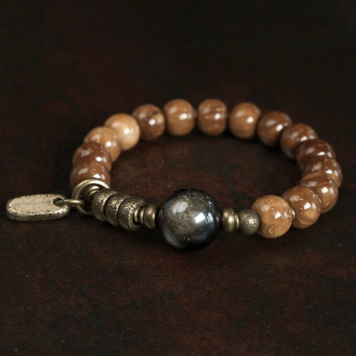 Bracelet porte-bonheur en cuivre et obsidienne dorée avec Buddha Stones de Kuka et œil de tigre
