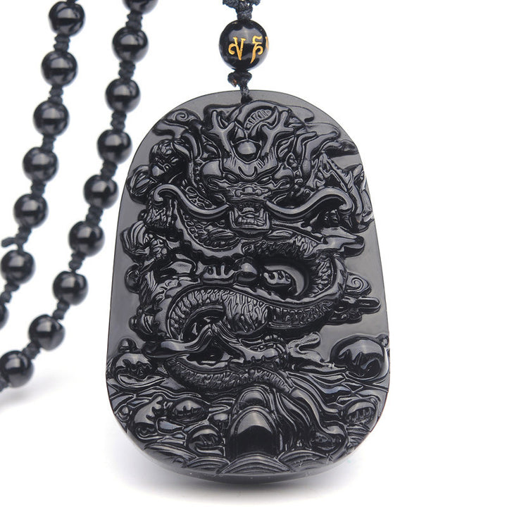 Collier avec pendentif en obsidienne noire représentant un dragon accompli et des Buddha Stones - Obsidienne - image 1