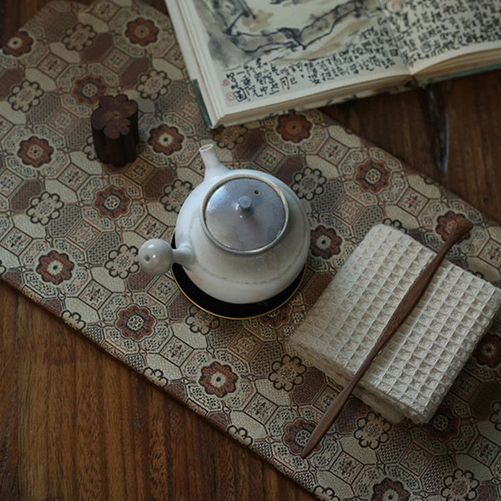 Dessous de verre élégant à motif de brocart floral pour tasse à thé