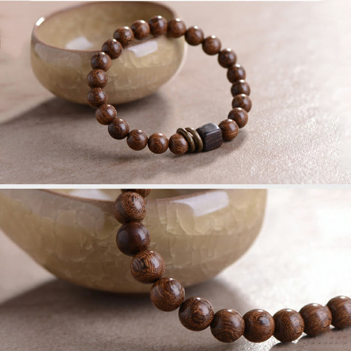 Bracelet de spiritualité en bois de Phoebe Zhennan Buddha Stones