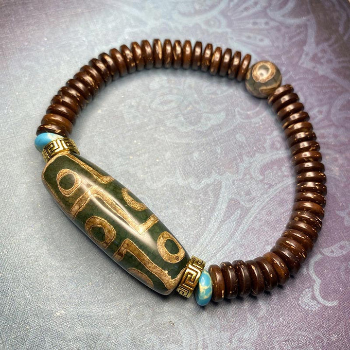 Bracelet de richesse en perles tibétaines à neuf yeux Dzi Buddha Stones