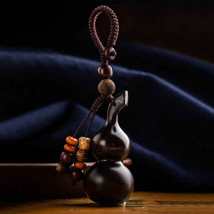 Porte-clés porte-bonheur en ébène tibétain à petites feuilles de gourde en bois de santal rouge