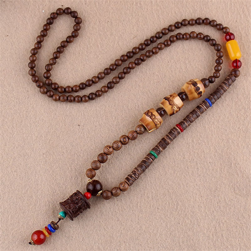 Collier pendentif protection éléphant en Buddha Stones tibétain en bois de wengé Bodhi Seed Agate