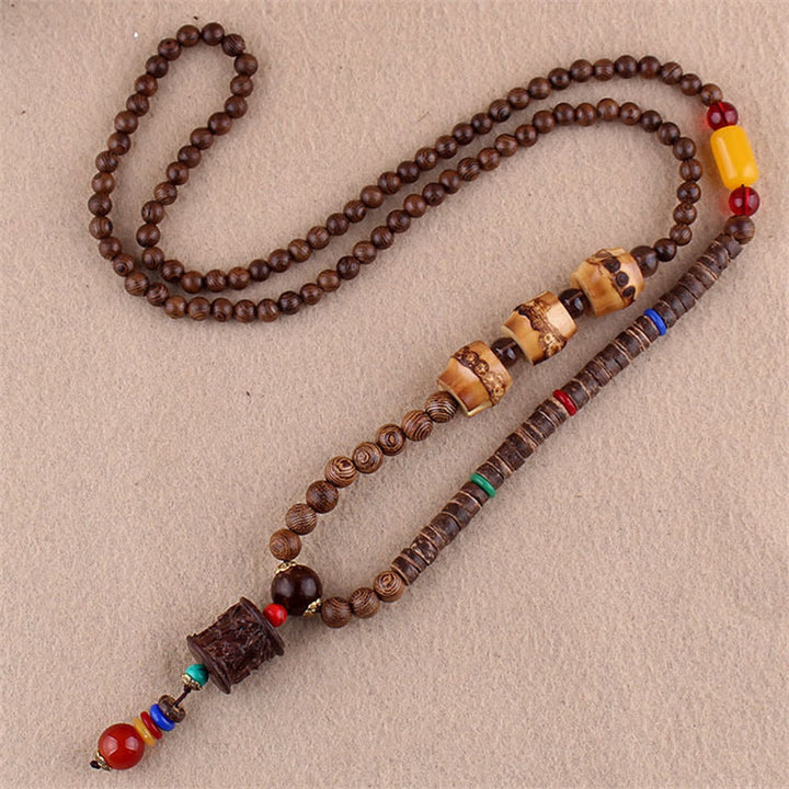Collier pendentif protection éléphant en Buddha Stones tibétain en bois de wengé Bodhi Seed Agate