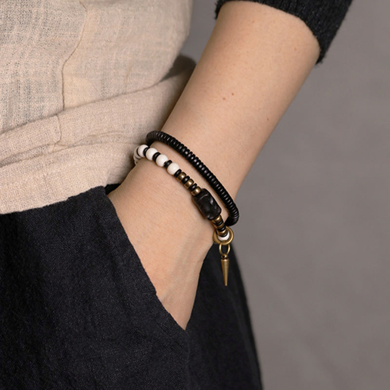 Bracelet couple force en bois d'ébène et cuivre, perles d'os et Buddha Stones