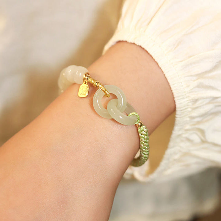 Bracelet tressé en perles de jade Hetian naturelles de Buddha Stones avec boucle de paix double et caractère Fu