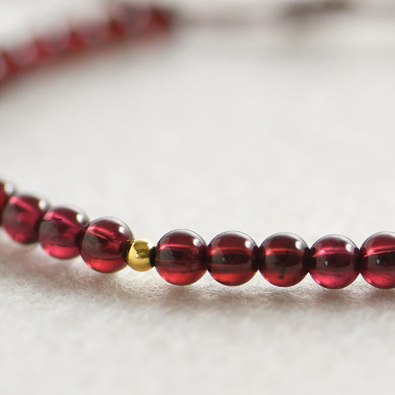Bracelet de stabilité en perles dorées et grenat naturel avec Buddha Stones - image 2