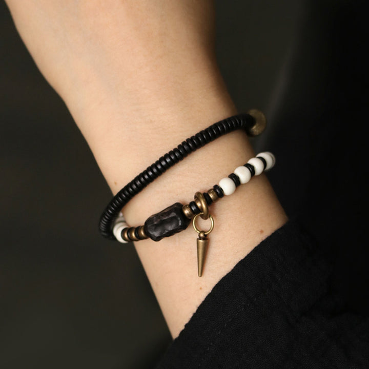 Bracelet couple force en bois d'ébène et cuivre, perles d'os et Buddha Stones