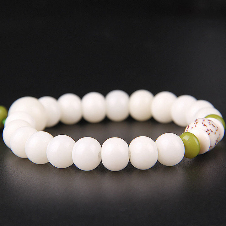 Bracelet porte-bonheur en Buddha Stones et lotus blanc naturel