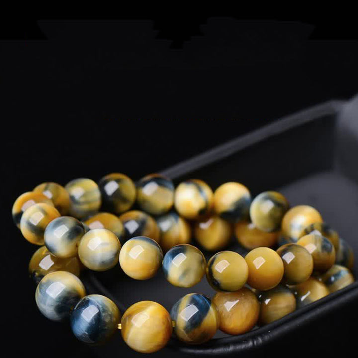 Bracelet de force, de courage et de protection en œil de tigre avec Buddha Stones