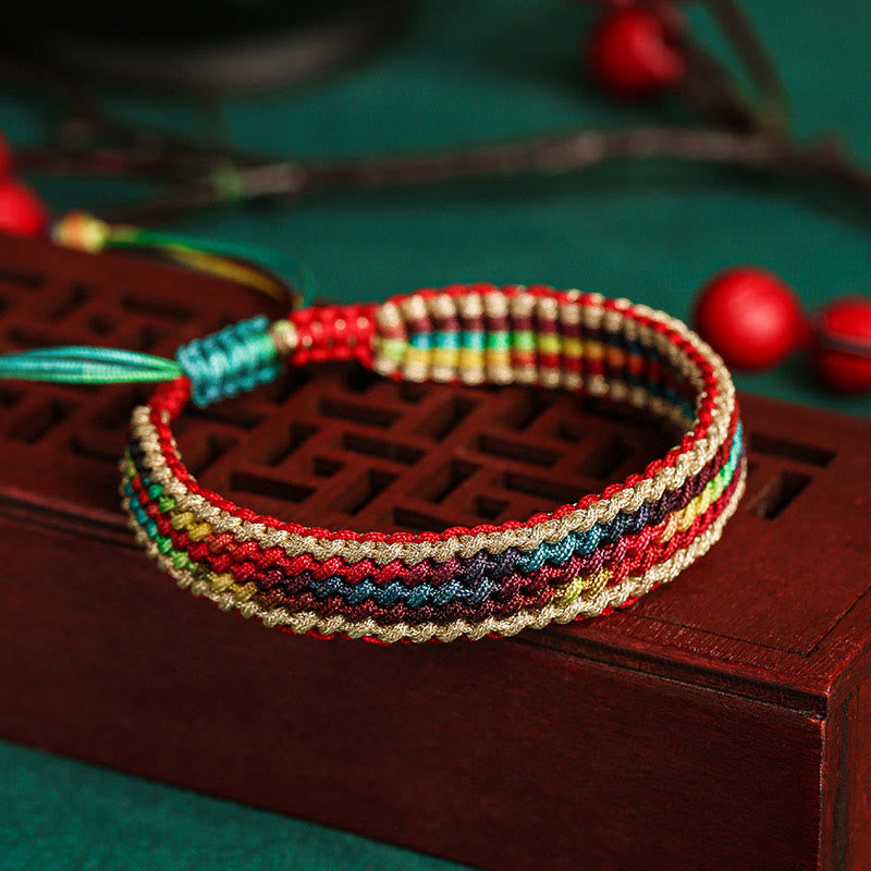 Bracelet tressé de protection multicolore arc-en-ciel fait main en Buddha Stones tibétaines