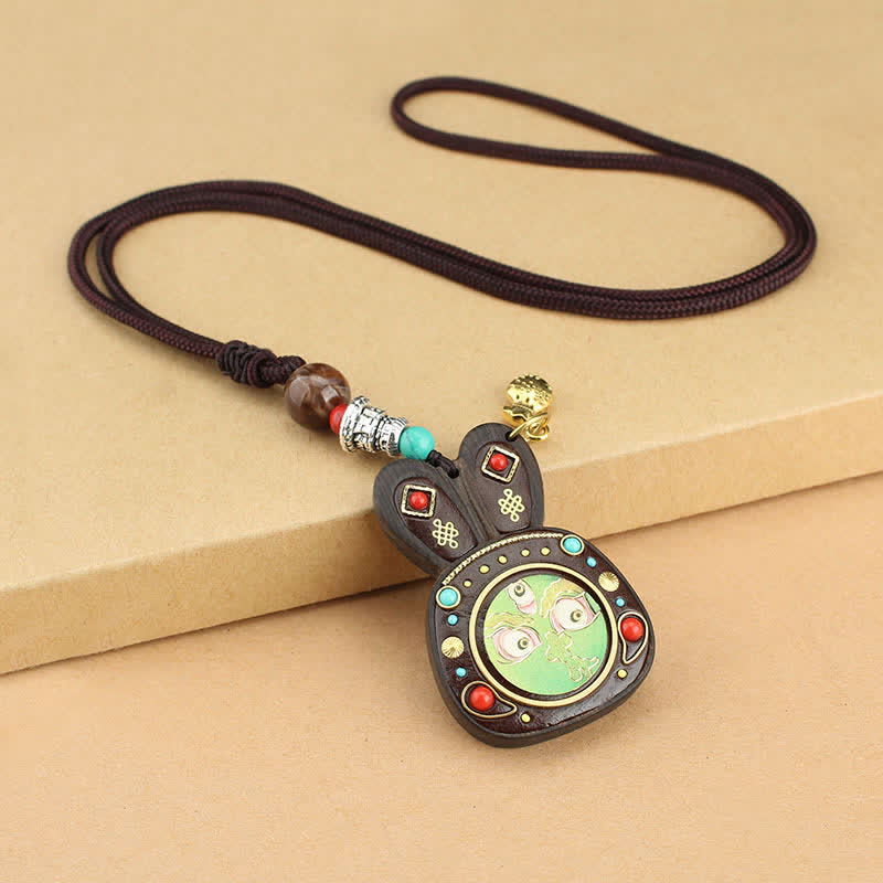 Collier pendentif Thangka en ébène du Tibet représentant les cinq dieux de la richesse