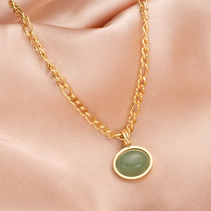 Collier pendentif ovale en acier titane et turquoise
