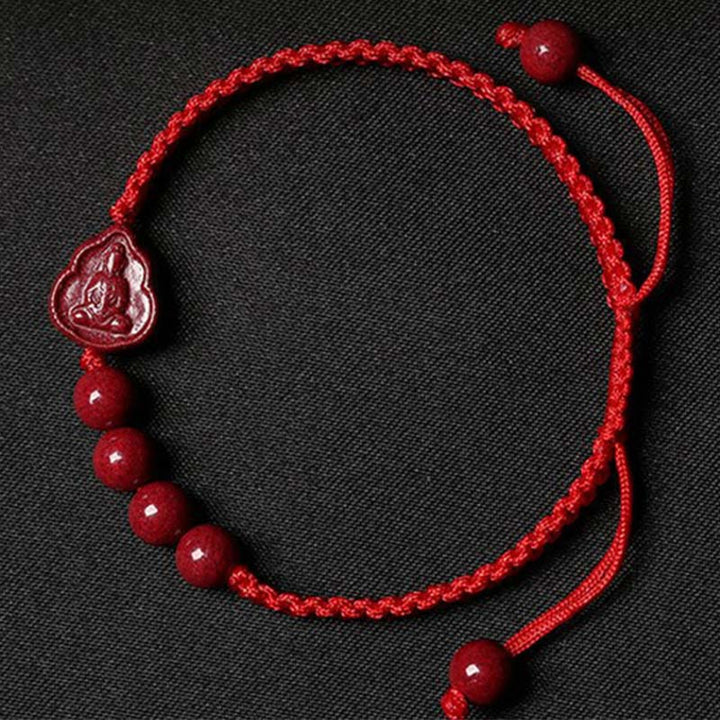 Bracelet en cordon de bénédiction en cinabre Bouddha rieur Avalokitesvara de Buddha Stones