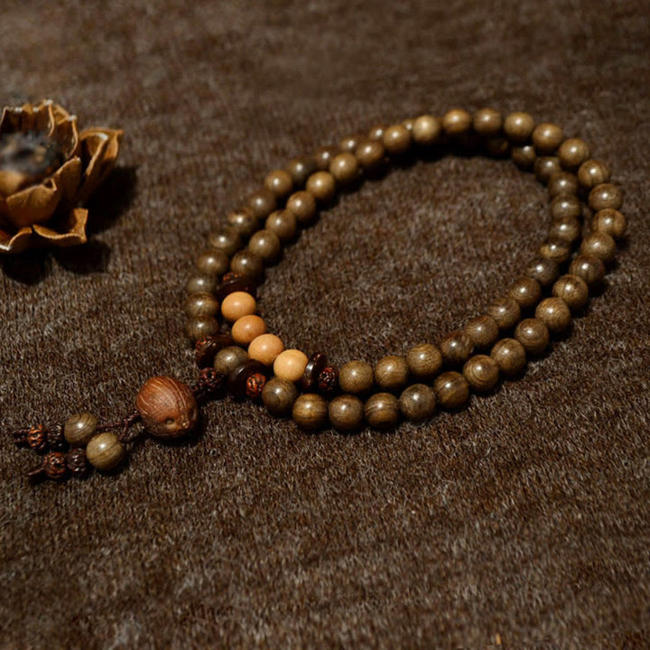 Bracelet Mala avec breloque de protection en bois de santal tibétain et Buddha Stones