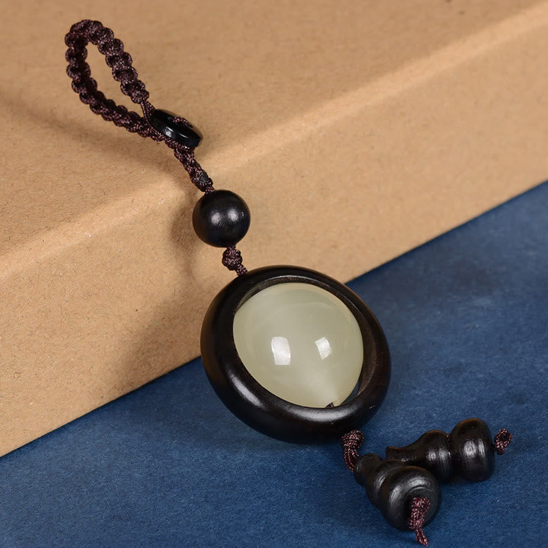 Porte-clés porte-bonheur lumineux en Buddha Stones en bois de santal rouge et bois d'ébène en bois de santal vert