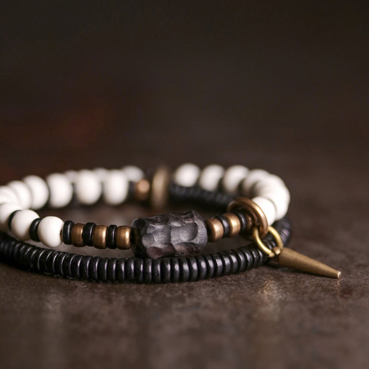 Bracelet couple force en bois d'ébène et cuivre, perles d'os et Buddha Stones