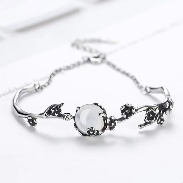 Bracelet positif en calcédoine et fleur de prunier avec Buddha Stones