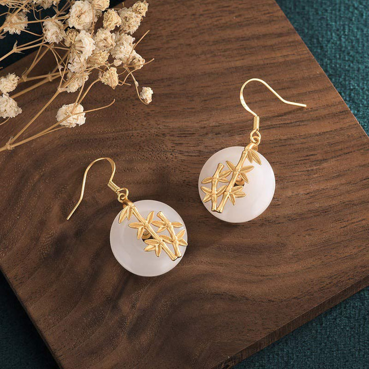 Boucles d'oreilles porte-bonheur en jade blanc Feng Shui Buddha Stones