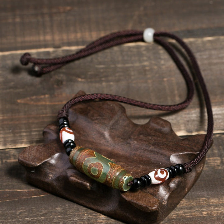 Collier de protection en perles tibétaines à neuf yeux Dzi Buddha Stones
