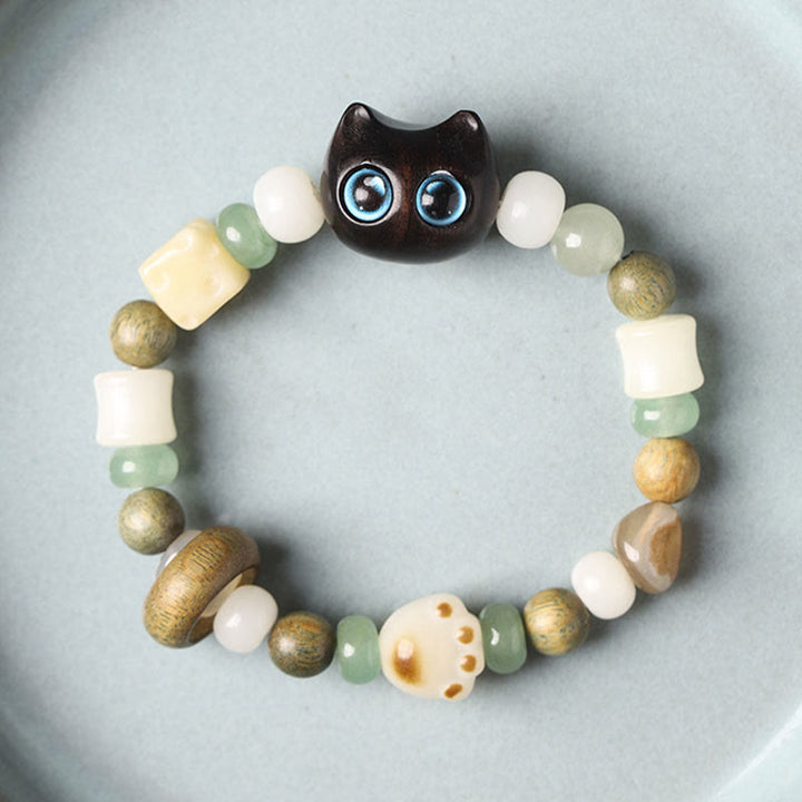 Buddha Stones Graine de Bodhi Bois de santal vert Bois d'ébène Petite feuille Bois de santal rouge Tête de chat Patte Griffe Bracelet de paix - image 3