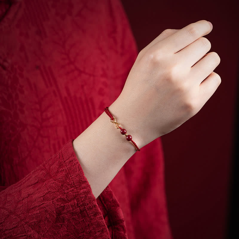 Bracelet de cheville avec symbole de l'infini doré et Buddha Stones et bénédiction en cinabre - image 1