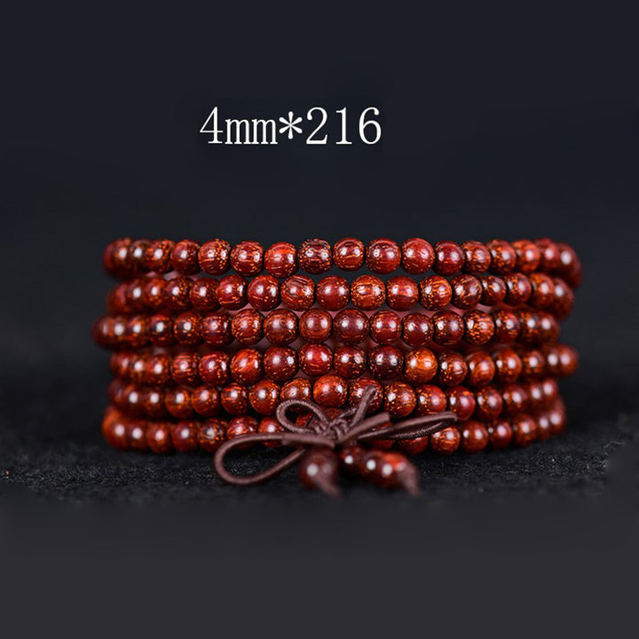 Bracelet d'équilibre tibétain en petites feuilles de santal rouge avec Buddha Stones