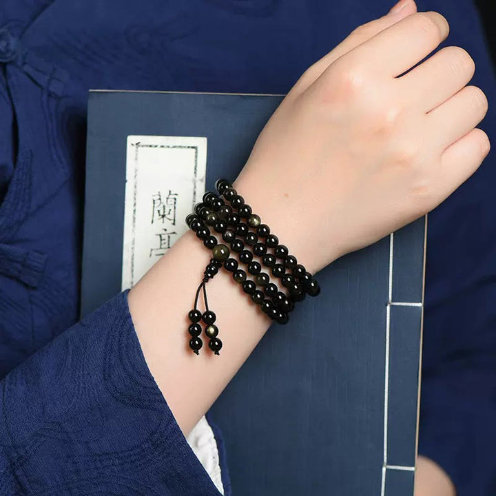 Bracelet de richesse en obsidienne naturelle dorée avec 108 perles de Mala Buddha Stones