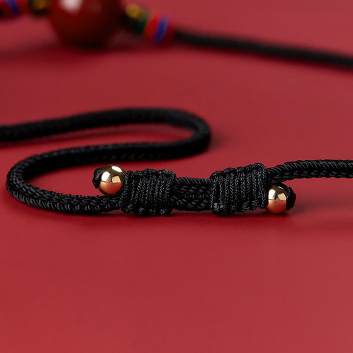 Collier avec pendentif en perles de cinabre et Buddha Stones