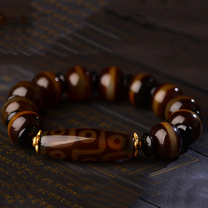 Bracelet tibétain en agate naturelle à neuf yeux avec perles dzi et Buddha Stones