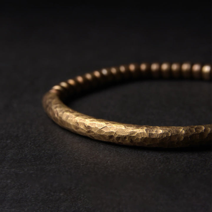 Bracelet porte-bonheur en perles de cuivre et de laiton au design simple Buddha Stones