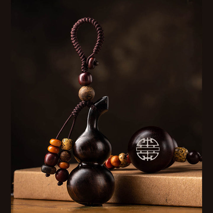 Porte-clés porte-bonheur en ébène tibétain à petites feuilles de gourde en bois de santal rouge