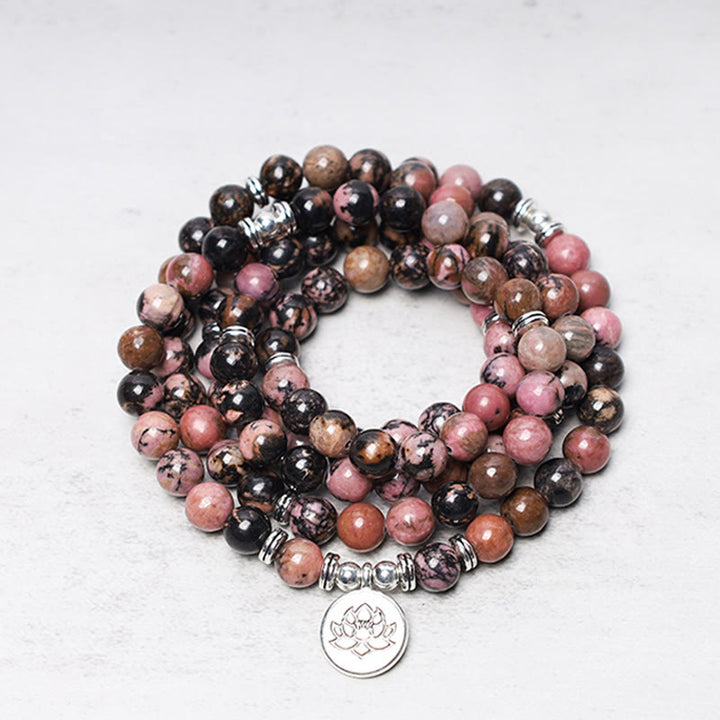 Bracelet Mala 108 Buddha Stones en rhodonite et lotus avec énergie de compassion