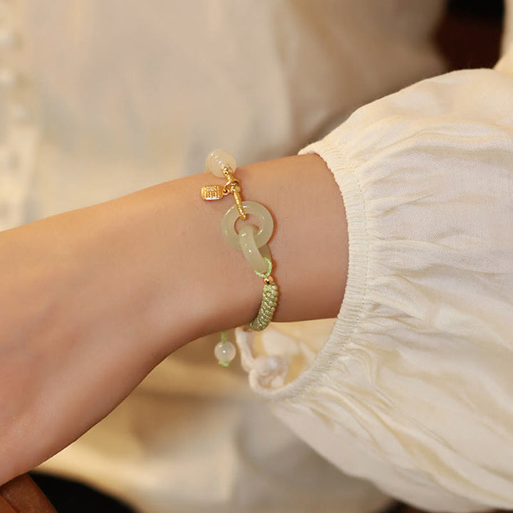 Bracelet tressé en perles de jade Hetian naturelles de Buddha Stones avec boucle de paix double et caractère Fu