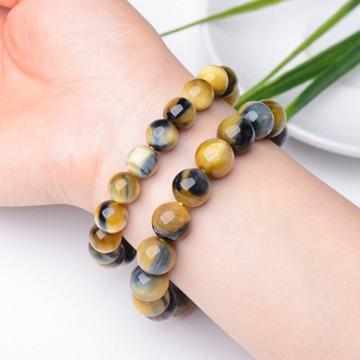Bracelet de force, de courage et de protection en œil de tigre avec Buddha Stones