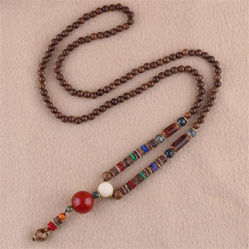 Collier pendentif protection éléphant en Buddha Stones tibétain en bois de wengé Bodhi Seed Agate