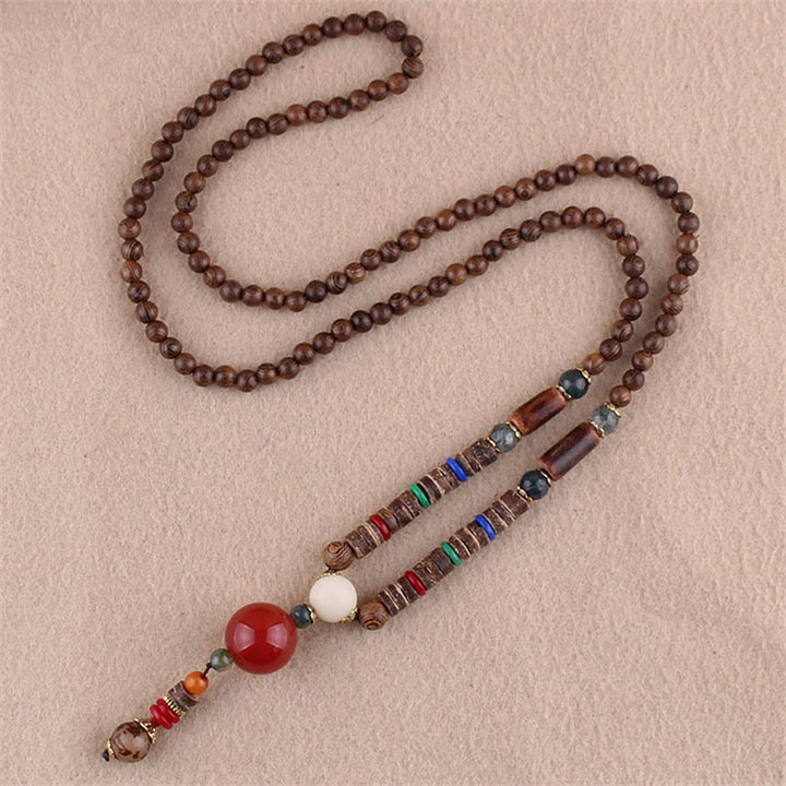 Collier pendentif protection éléphant en Buddha Stones tibétain en bois de wengé Bodhi Seed Agate