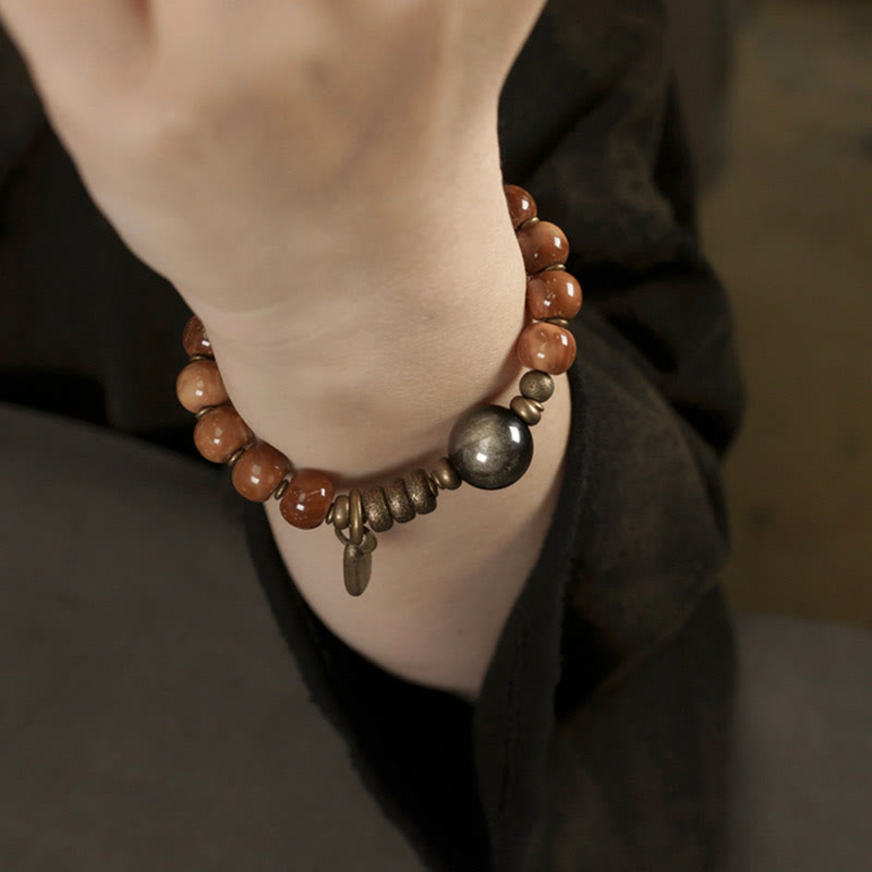 Bracelet porte-bonheur en Buddha Stones, graines de Kuka, œil de tigre, reflets dorés, obsidienne, laiton et cuivre - image 12