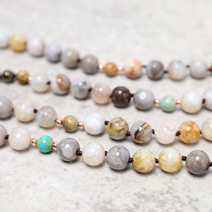 Collier de guérison en perles de jaspe Picasso naturel de l'océan Buddha Stones