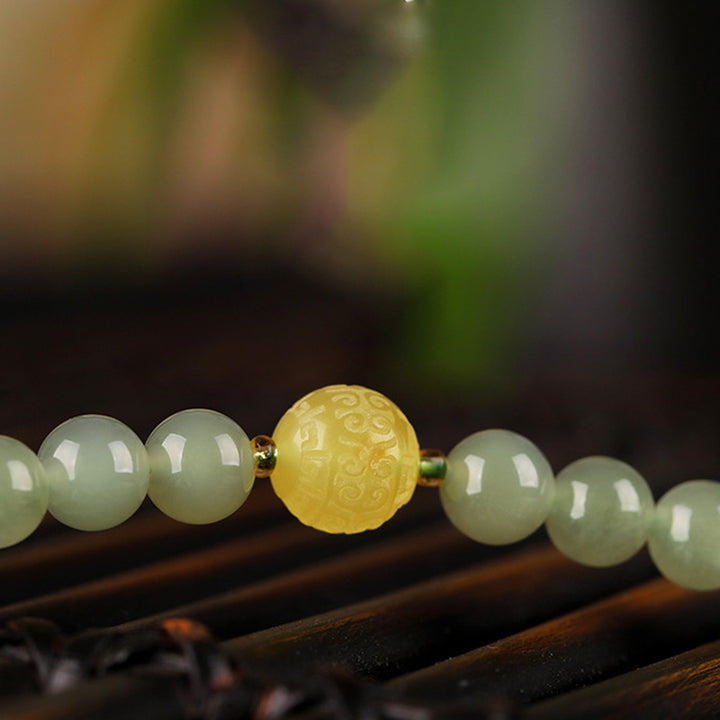 Bracelet de prospérité Bouddha rieur en jade agate rouge et ambre