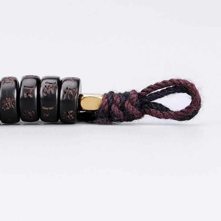 Bracelet en corde Buddha Stones perles de noix de coco tibétaines gravées avec le mantra positif Om Mani Padme Hum