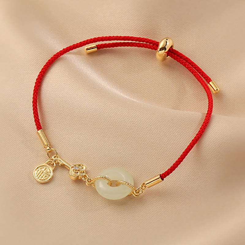 Bracelet en corde rouge avec boucle de paix en jade Hetian plaqué or 18 carats et Buddha Stones