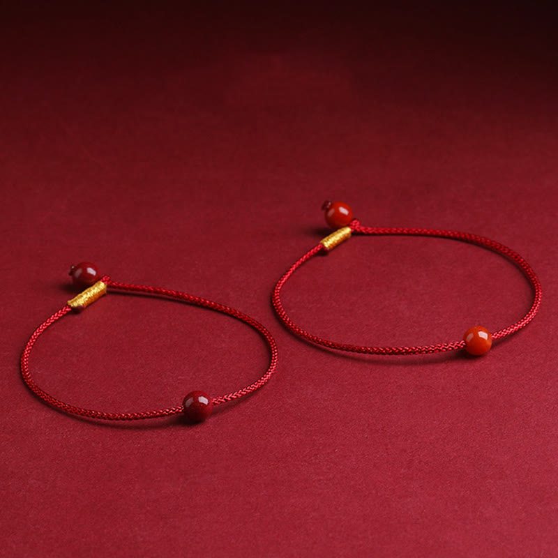 Bracelet en fil rouge avec bénédiction en agate rouge cinabre naturelle de Buddha Stones