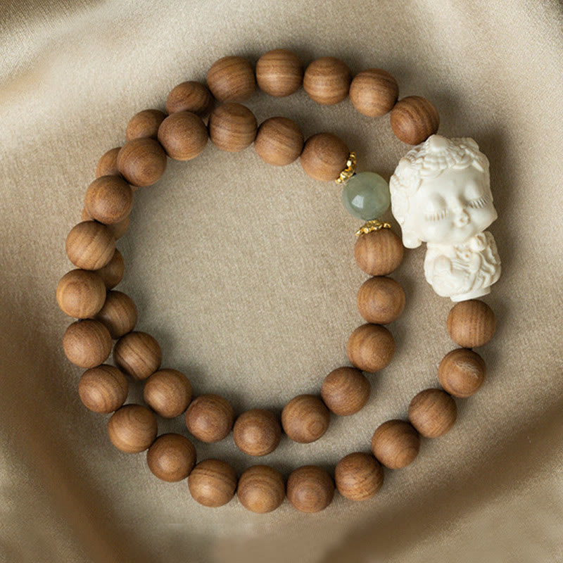 Bracelet de protection Tara verte en Buddha Stones en bois de santal et jade Hetian