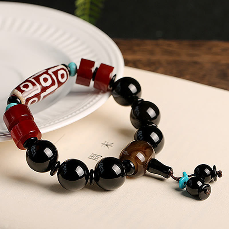 Bracelet tibétain de protection de richesse en onyx noir avec perles dzi à neuf yeux