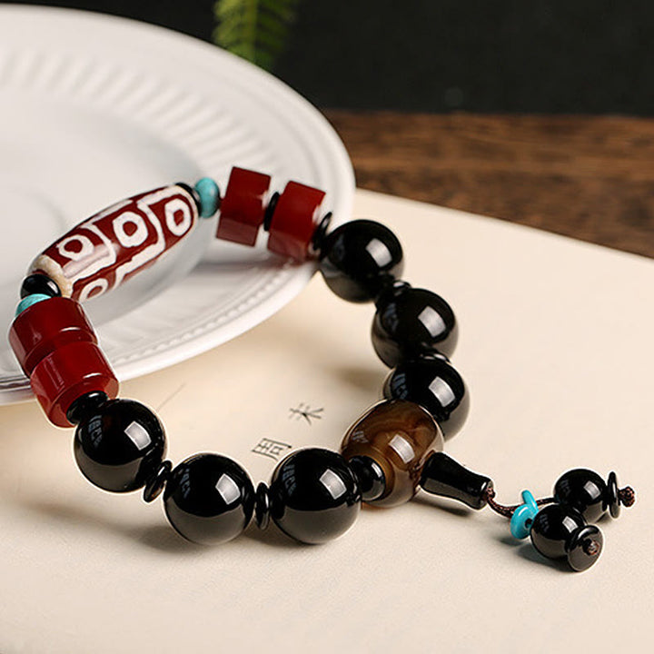 Bracelet tibétain de protection de richesse en onyx noir avec perles dzi à neuf yeux